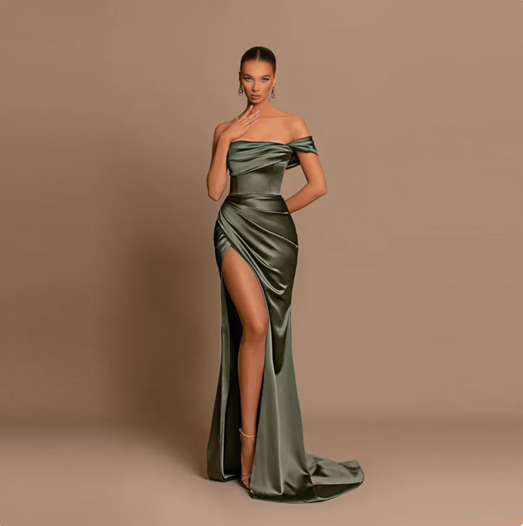 Experience timeless elegance with this exquisite one-shoulder mermaid evening dress. Crafted from delicate silk, the high-slit skirt, off-shoulder sleeves and classic design create an alluring silhouette, perfect for a formal prom or wedding. Nothing says luxury like this timeless piece.