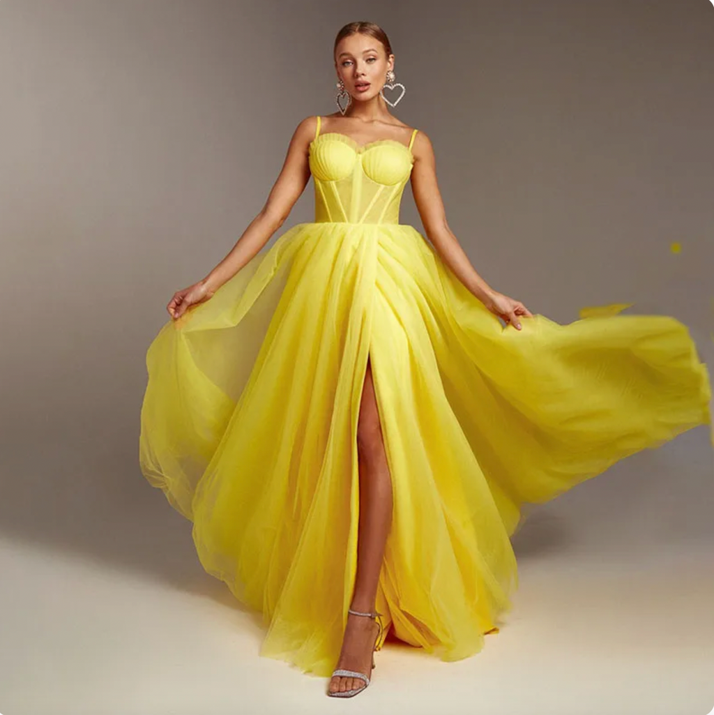 Bring a taste of sunshine to any event with the Robe Maysena dress! This bright yellow stunner features elegant spaghetti straps, sweetheart neckline and a fit that accentuates all of your best assets. Shine on your night out in perfect style!