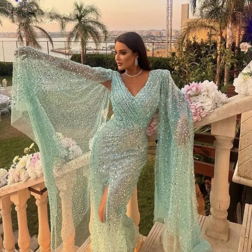 Show off in Laylina, a luxurious evening gown tailored from quality fabric for a glamorous appearance. Its intricate applique and curves flatter all body types. Make a statement in this stunning gown!