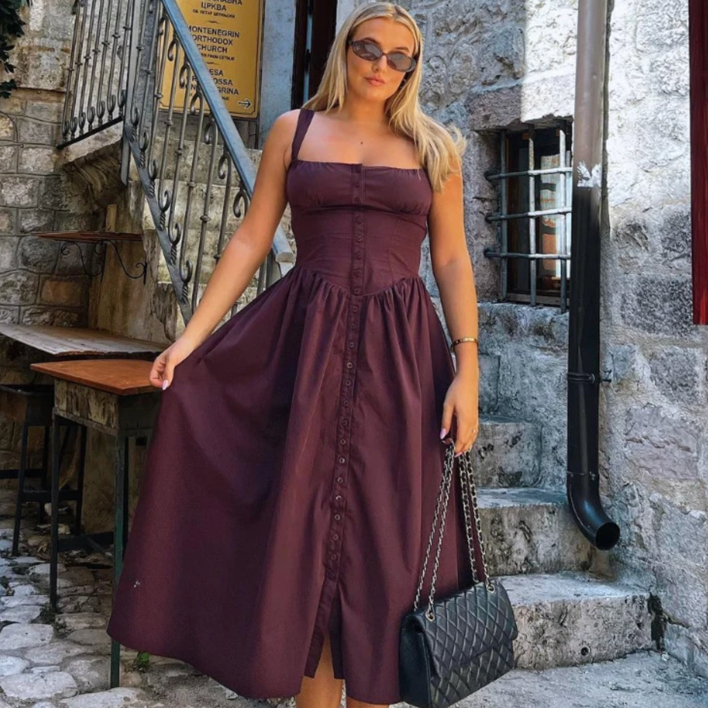 Experience the height of fashion with Dress Tatiana! This trendy midi dress boasts a flattering spaghetti strap design and a stunning brown color that will turn heads. Its long, flowing silhouette adds elegance to any outfit, making it the perfect choice for any occasion. Become a trendsetter with Dress Tatiana!