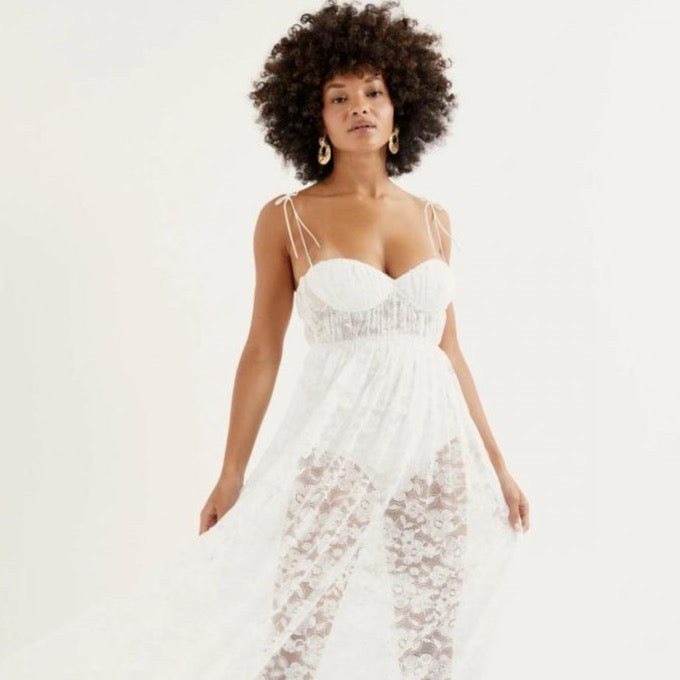 Introducing the Dress Lorena, a stunning addition to the Womens For Love & Lemons collection. Channel your inner goddess in this ethereal white maxi dress, featuring a transparent fabric for a touch of allure. Perfect for any special occasion or night out.