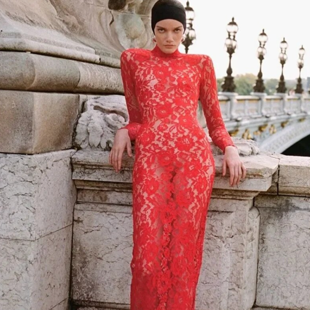 Introducing the Dress Ursula, a masterpiece of elegance and sophistication. This sexy red lace dress, featuring a half high collar and alluring hollow out design, is the epitome of luxury and style. Don't just make a statement, make an entrance with the Dress Ursula.