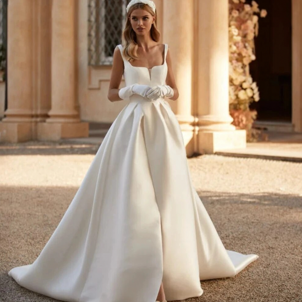 Look stunning on your special day with the Robe Grisella. This beautiful satin dress features an off-the-shoulder sweetheart neckline and soft, silky material, ideal for a romantic, fairytale-inspired wedding. Fluffy moping and simple style gives it a classic, elegant feel. Make your dream come true with the Robe Grisella!