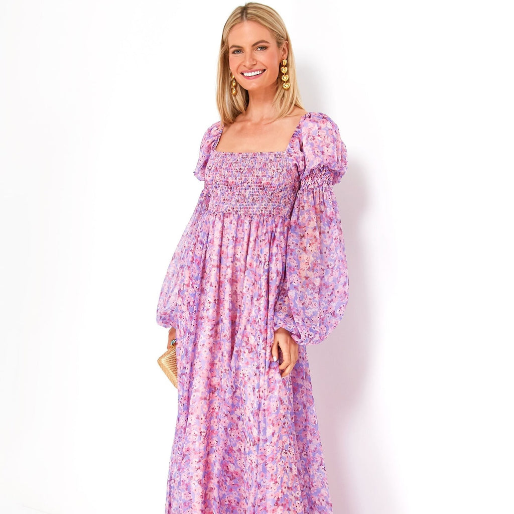 Indulge in luxury with CAROLINE CONSTAS' Periwinkle Spring Blossom Chiffon Dress. Made with delicate chiffon, the dress features a beautiful spring blossom design in soft periwinkle. This dress will make you feel elegant and exclusive, perfect for any sophisticated event.