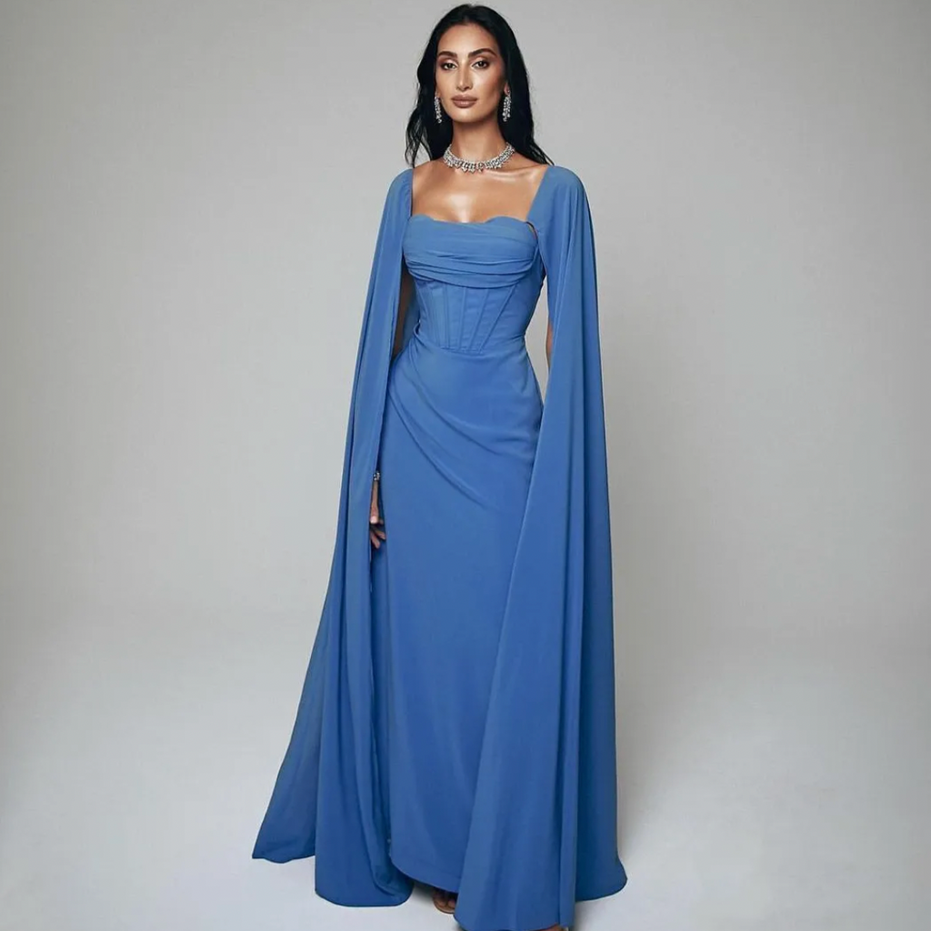 Elevate your style with Dress Rosine. Its square neckline and elegant design create a flattering silhouette. The floor length hem and ruffle details add a touch of elegance. And with a court train and zipper closure, it's the perfect choice for any formal occasion. Make a statement in blue.