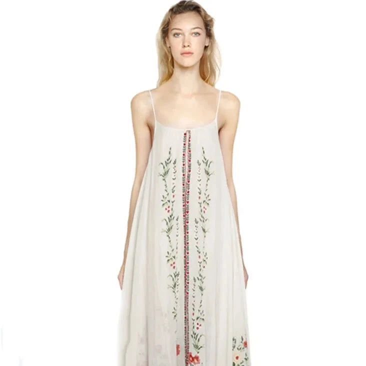 Introducing the Dress Josephine, the perfect summer dress with retro national wind design and delicate flower embroidery. Travel in style with this bohemian beach dress that comes with a halter belt for a flawless fit. Embrace the comfort and elegance of this must-have addition to your wardrobe.