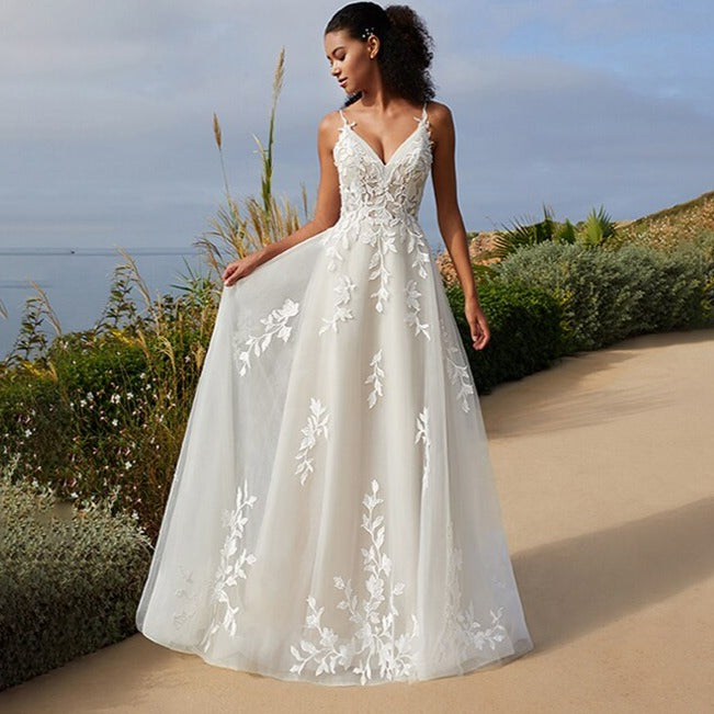 Indulge in luxury with our Robe Velvete, a mermaid wedding dress with delicate straps and intricate appliques. Exude confidence and sensuality on your special day with this sexy piece.