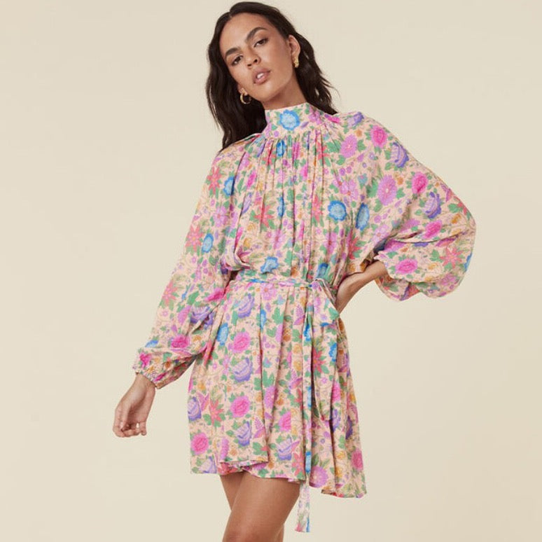 Be chic and cool in the Robe Mossy. This mid-length robe features a high neckline, lace-up closure, and long sleeves, crafted from a unique vintage inspired print for a timeless look. Complete with decorative tassels at the neckline, it's the perfect way to look fashionable and elegant.