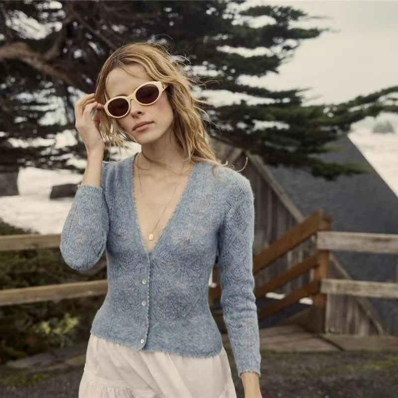 Introducing the Cardigan Brigitta - your go-to for the spring and summer seasons. Made with a wool blend, this V-neck cardigan features a delicate crochet detail, perfect for adding a touch of elegance to any outfit. Stay stylish and cool with this must-have knit.
