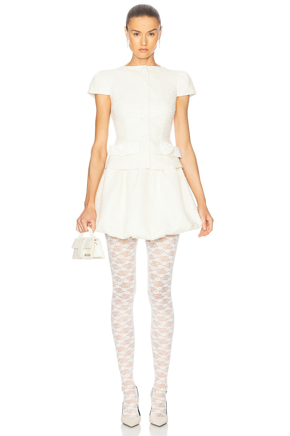 Look absolutely stunning in this dry clean only, fully lined mini dress. The front partial button closure and hidden side zipper make it both stylish and practical. The 3D floral-bow detail at the waist, along with the tweed fabric and sequin embellishment, add a touch of elegance to the dress. Don't miss out on the unique bubble hem that sets this dress apart from the rest!