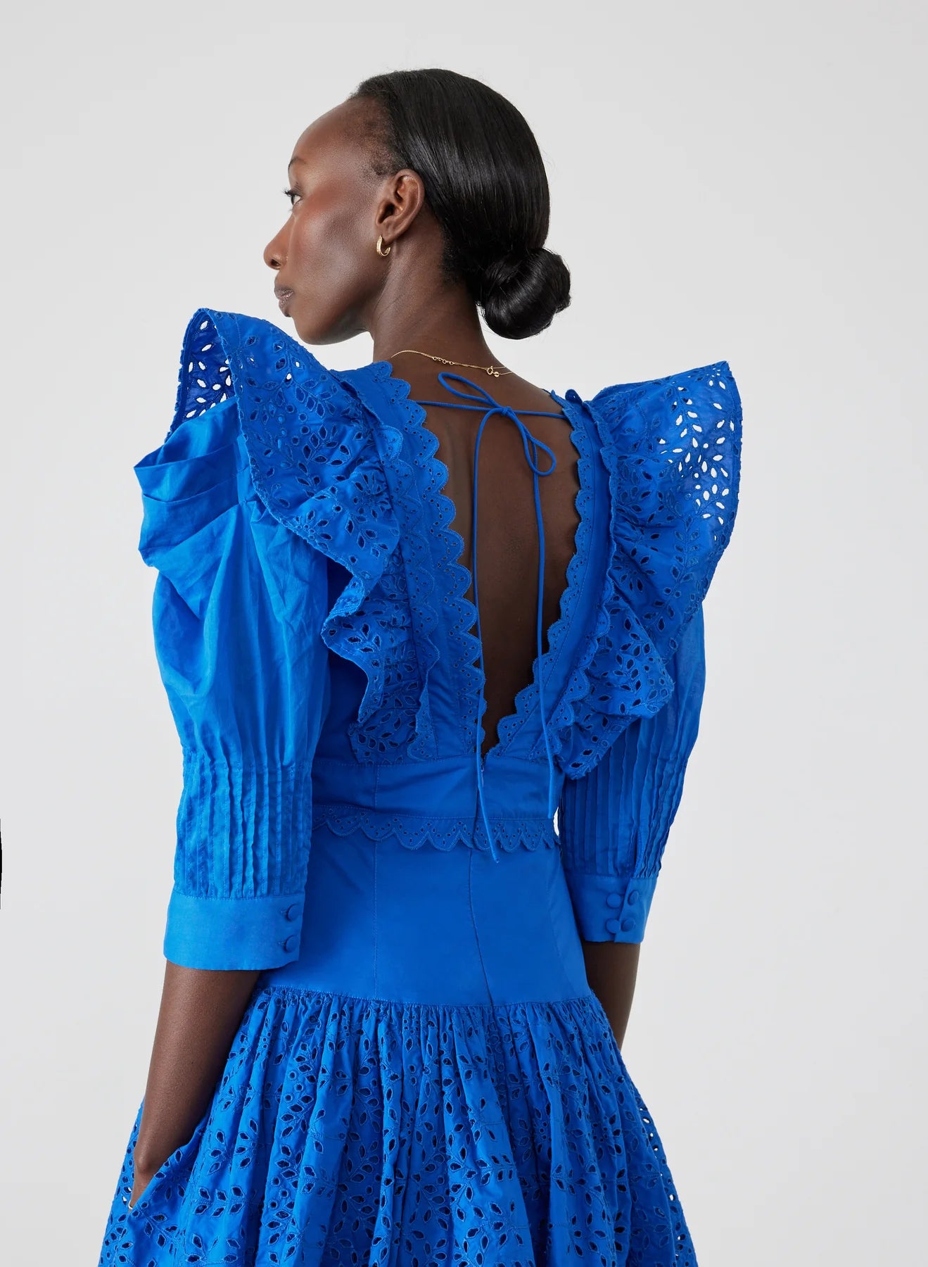 Elevate your style with Viktoria Broderie Mini Dress by Joslin. This certified organic cotton poplin dress embraces timeless charm and modern sophistication, perfect for the contemporary woman. Featuring a modest plunge neckline, contrast cotton broderie details, and stunning structured cotton organdy mutton sleeves, Viktoria exudes classic elegance with a touch of allure.