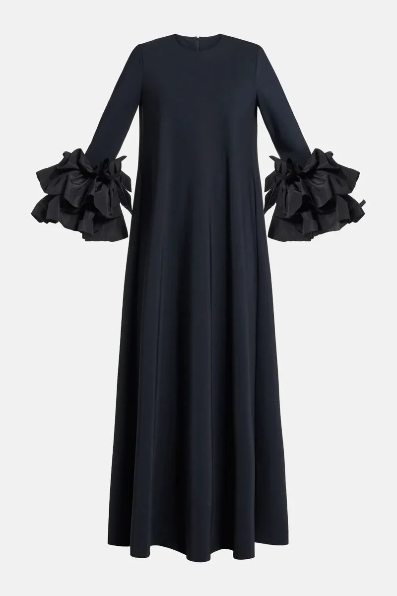 Experience elegance and grace in the Long Sleeve Anessa Gown. With a bateau neckline and stunning appliques on the long sleeves, this gown will make you shine. The long keyhole bodice adds a touch of allure, while the full back provides comfort and support. Elevate your special occasion look with this timeless and sophisticated dress.