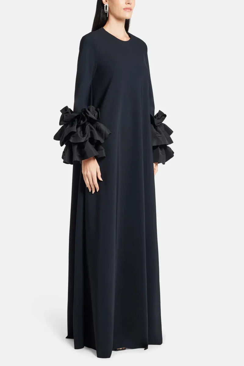 Experience elegance and grace in the Long Sleeve Anessa Gown. With a bateau neckline and stunning appliques on the long sleeves, this gown will make you shine. The long keyhole bodice adds a touch of allure, while the full back provides comfort and support. Elevate your special occasion look with this timeless and sophisticated dress.