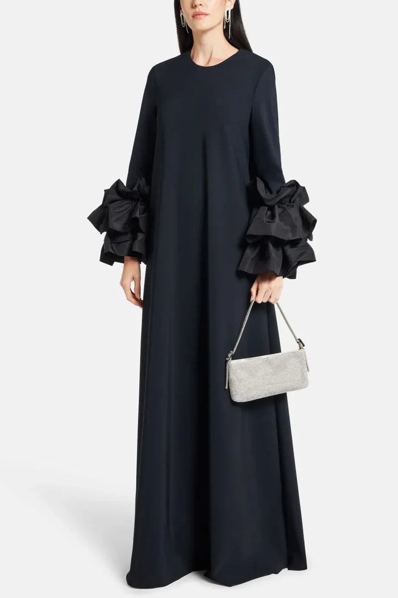 Experience elegance and grace in the Long Sleeve Anessa Gown. With a bateau neckline and stunning appliques on the long sleeves, this gown will make you shine. The long keyhole bodice adds a touch of allure, while the full back provides comfort and support. Elevate your special occasion look with this timeless and sophisticated dress.