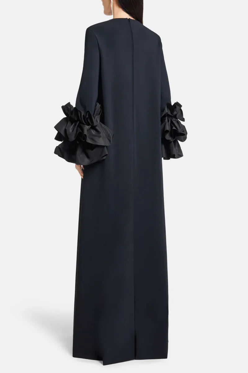 Experience elegance and grace in the Long Sleeve Anessa Gown. With a bateau neckline and stunning appliques on the long sleeves, this gown will make you shine. The long keyhole bodice adds a touch of allure, while the full back provides comfort and support. Elevate your special occasion look with this timeless and sophisticated dress.