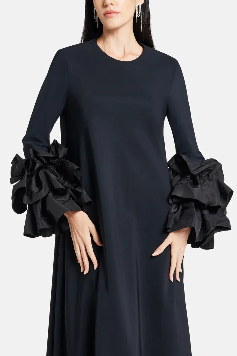 Experience elegance and grace in the Long Sleeve Anessa Gown. With a bateau neckline and stunning appliques on the long sleeves, this gown will make you shine. The long keyhole bodice adds a touch of allure, while the full back provides comfort and support. Elevate your special occasion look with this timeless and sophisticated dress.