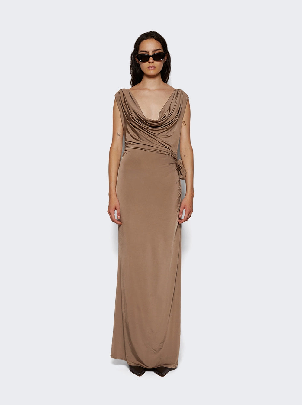 Add a touch of elegance to your wardrobe with the Cowl Neck Jersey Midi Dress by Magda Butrym! The jersey fit and cowl neck design create a flattering silhouette, while the high slit and flower detail add a touch of sophistication. Perfect for any occasion, this dress will make you feel confident and stylish.