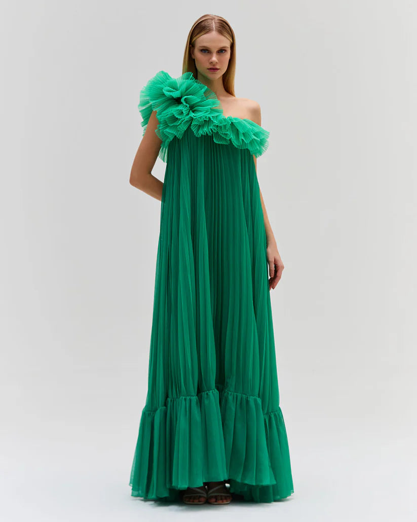 Elevate your style with the Pleated One Shoulder Gown. Made from luxurious pleated chiffon, this dress features a dramatic one shoulder neckline, adding a touch of glamour to your look. Be a part of the Spring 2024 Runway Collection and make a statement at your next event. Fully lined for maximum comfort.