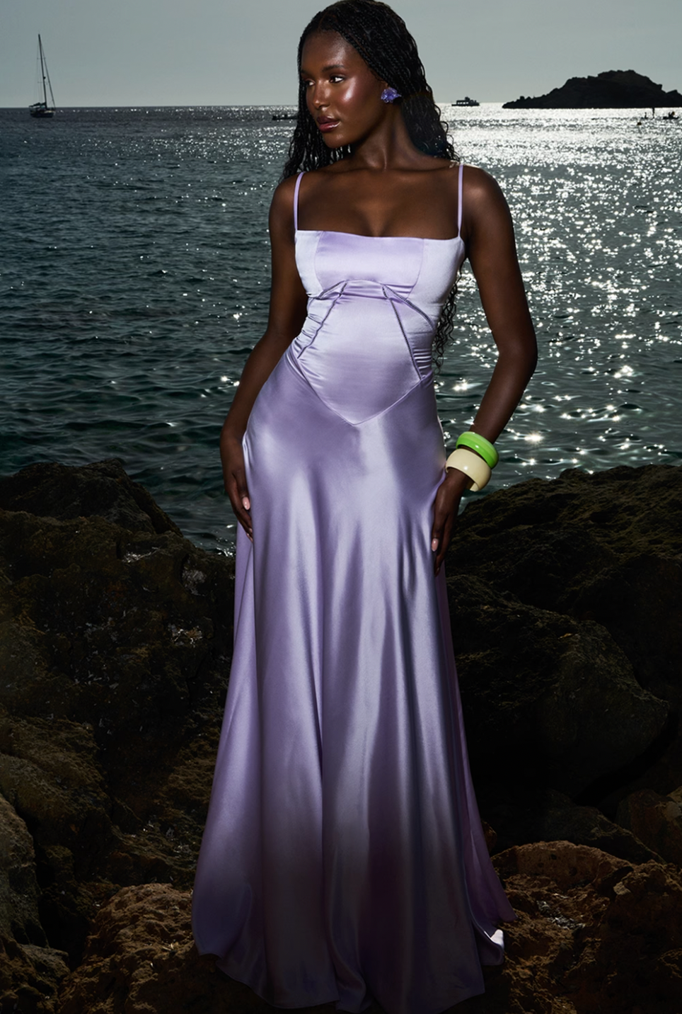 Introducing Anabella, the ultimate wedding guest essential. This stunning maxi dress showcases luxurious lustrous satin in an enchanting Orchid hue that commands attention. The flattering neckline paired with delicate rouleau shoulder straps creates an effortlessly sophisticated silhouette. Perfect for those seeking timeless elegance and refined style, Anabella transforms any occasion into a moment of pure glamour. 