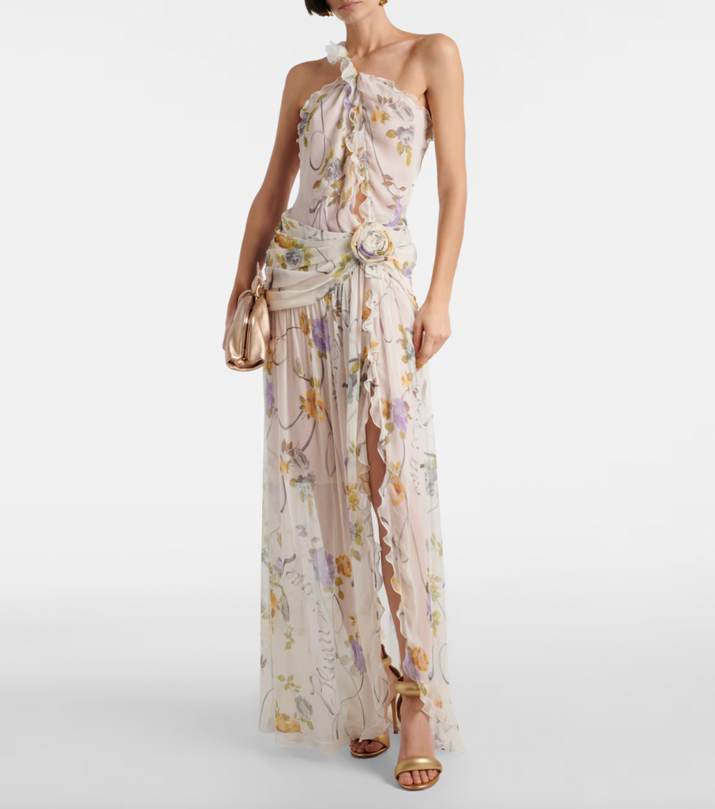 Step into a garden of elegance with this Floral Silk Creponne Maxi Dress by Blumarine. Its flowing silk fabric drapes beautifully, while vibrant floral patterns add a touch of whimsy. Perfect for dancing through sunny days or dreamy evenings, this dress combines comfort with effortless charm to brighten any occasion.
