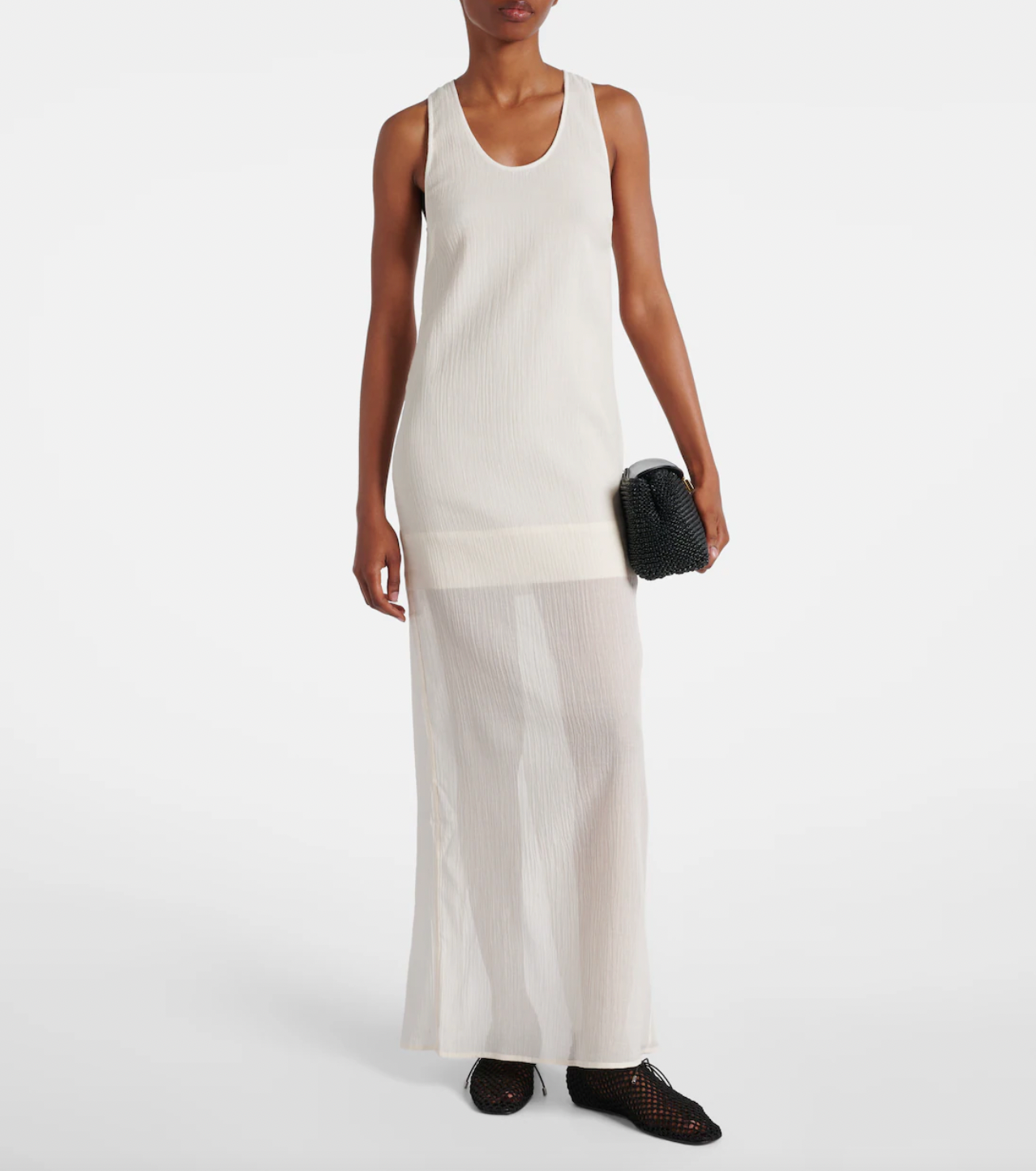 Embrace effortless elegance with this Cotton and Silk Maxi Dress from Toteme. Featuring a blend of soft cotton and luxurious silk, its semi-sheer top layer adds a subtle, modern allure. Designed as a contemporary uniform piece, this dress elevates your wardrobe with timeless style and refined comfort, perfect for defining your dress code with confidence.