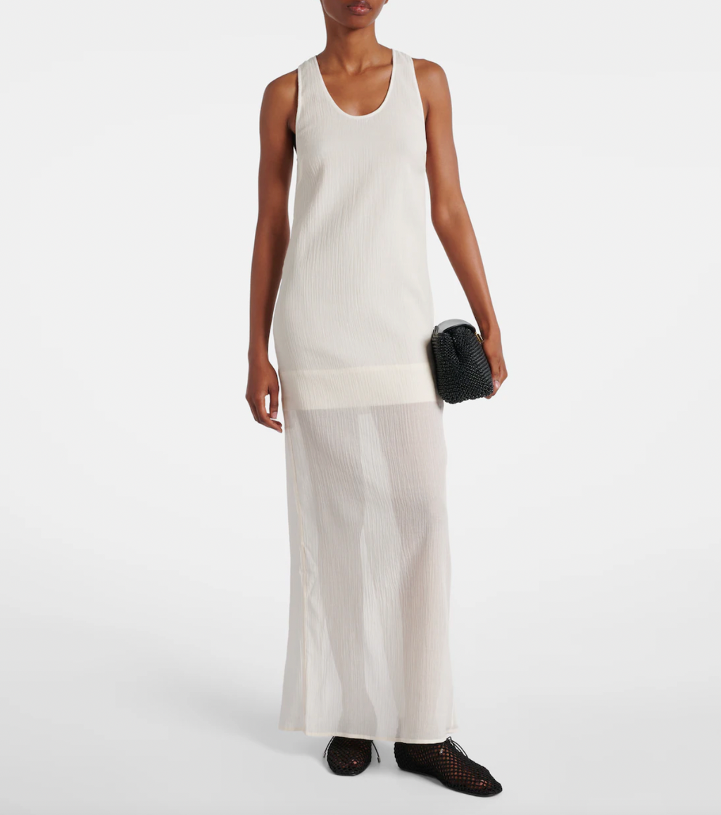 Embrace effortless elegance with this Cotton and Silk Maxi Dress from Toteme. Featuring a blend of soft cotton and luxurious silk, its semi-sheer top layer adds a subtle, modern allure. Designed as a contemporary uniform piece, this dress elevates your wardrobe with timeless style and refined comfort, perfect for defining your dress code with confidence.