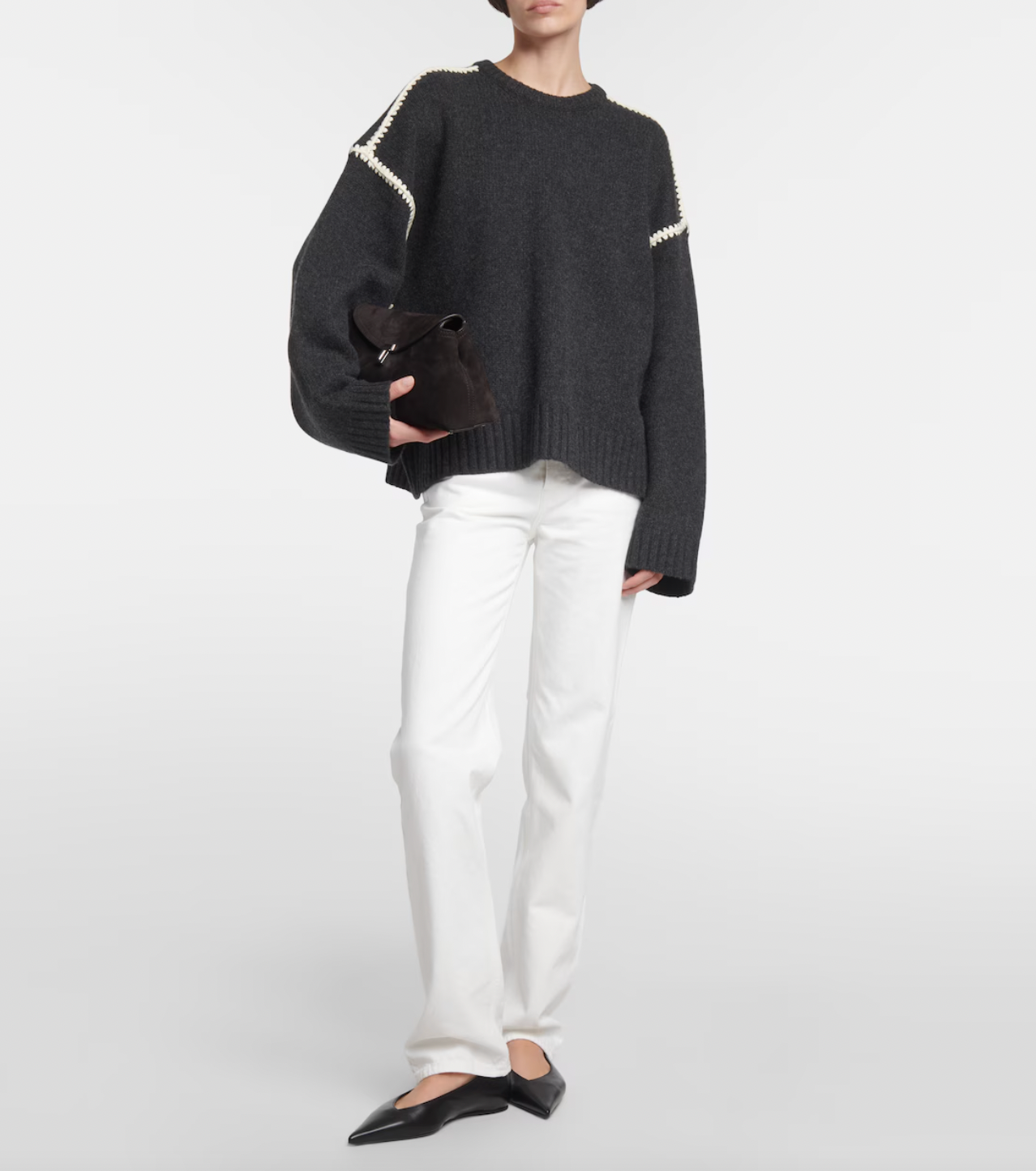 Elevate your wardrobe with this oversized sweater by Toteme crafted from a sumptuous wool and cashmere blend. Its relaxed fit with dropped shoulders offers effortless comfort, while the contrasting cream embroidery adds a refined, distinctive touch. Designed as a timeless staple, it seamlessly enriches your collection, providing both warmth and style for any occasion.