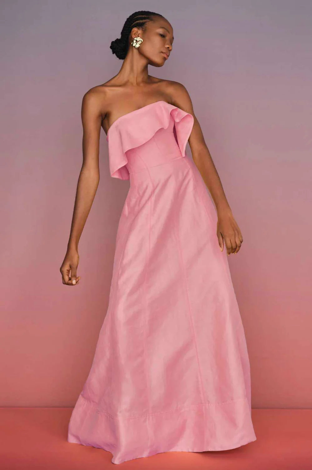 Elevate your evening wardrobe with the Aje Shallows Strapless Linen-Blend Gown in blush pink. This sophisticated piece features a strapless neckline adorned with an asymmetrical draped overlay, creating an elegant focal point. Internal boning provides a sculpted silhouette while the fitted bodice transitions into a graceful column skirt that moves beautifully with every step. Practical side seam pockets add everyday functionality to this statement piece. 
