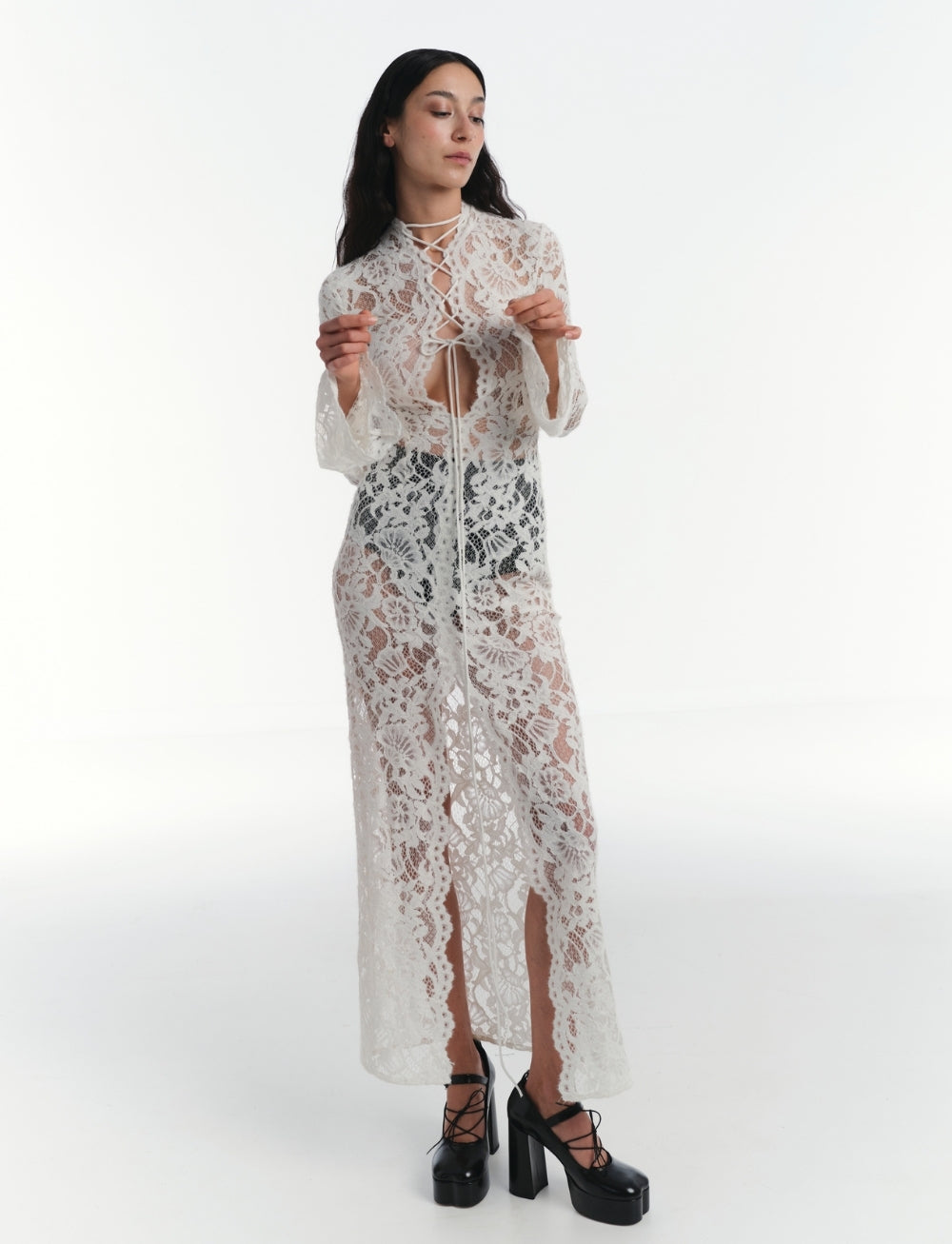 Discover your inner rebel with the Sally lace midi dress! Dare to stand out in this black stunner featuring intricate lace and semi-sheer fabric. Edgy cut-out and lace-up details, along with a front slit and straight hem, take your style to the next level. Are you ready for the adventure? This dress has got you covered!