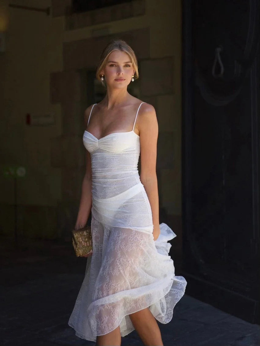 Indulge in elegance with the Adela Lace Dress. This delicate and daring piece features a feminine silhouette, sweetheart neckline, and sheer double layered lace for a charming touch. With a midi length perfect for any summer occasion, this dress exudes luxury and sophistication.