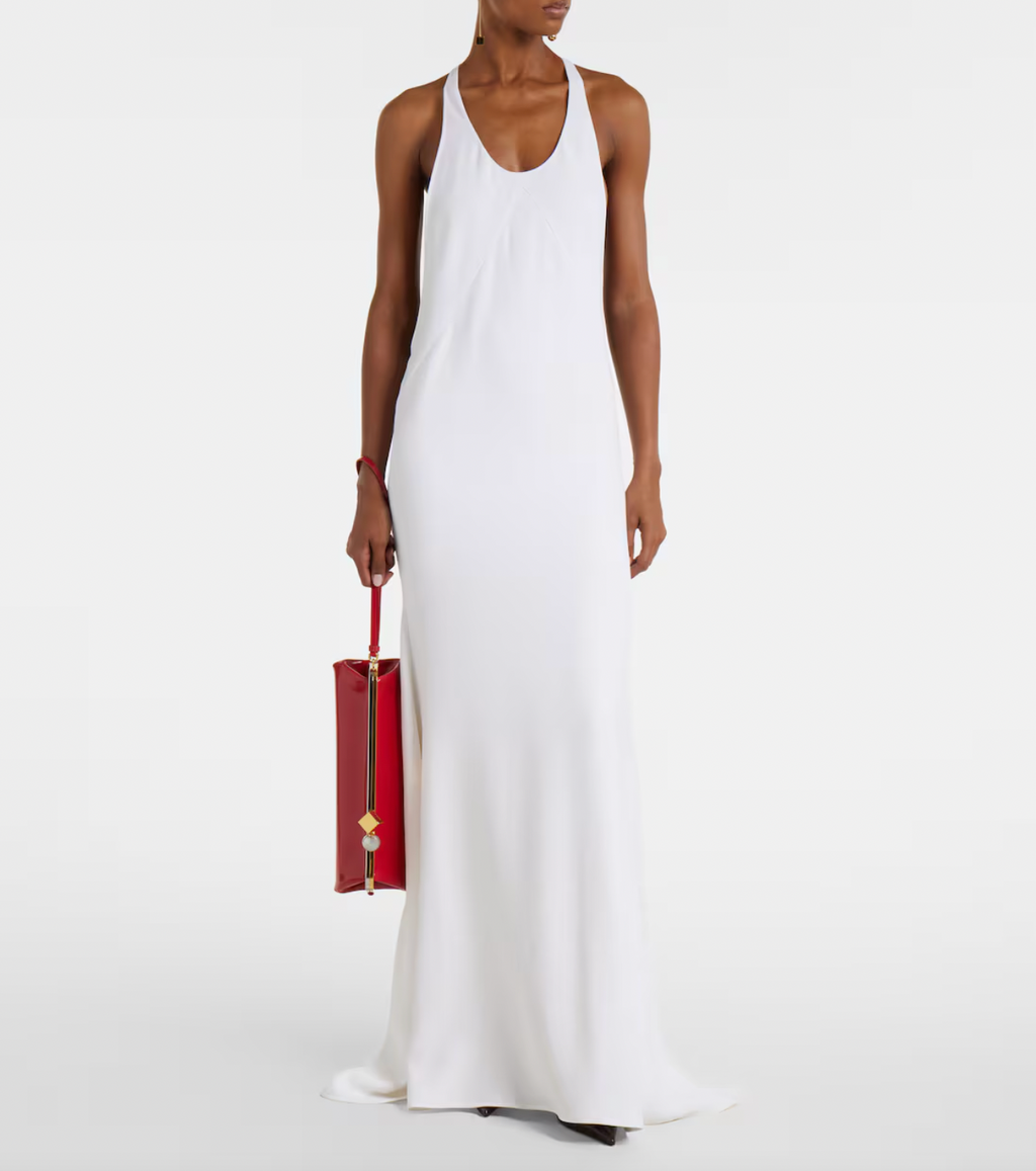 Experience timeless elegance with this Jacquemus-inspired knitted gown. Crafted in a crisp white hue, its minimalist design features a sleeveless silhouette and a graceful scoop neckline, creating a refined and effortlessly sophisticated look that flows beautifully to the floor. Perfect for those seeking understated luxury with a modern touch.