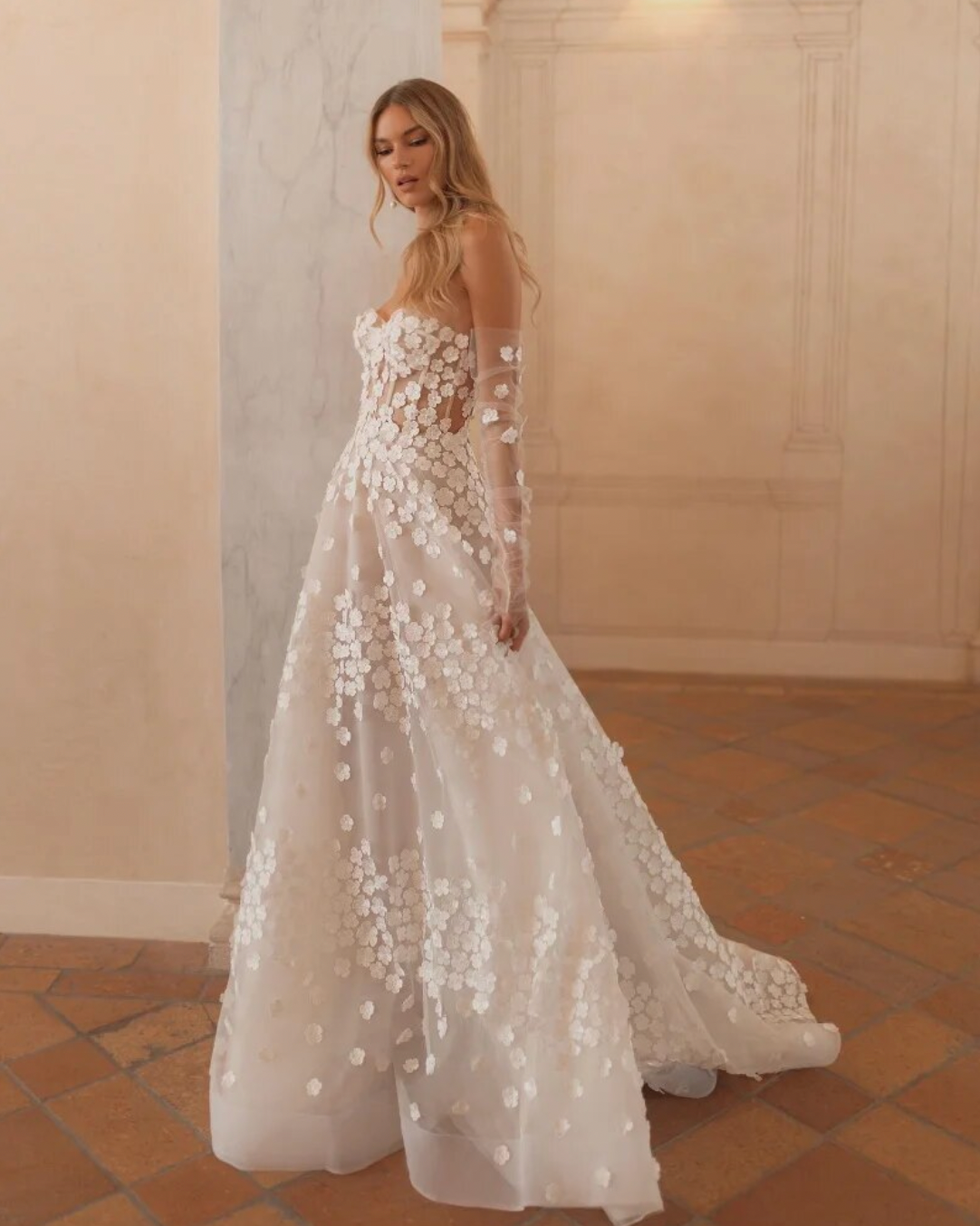 Step into elegance with our Dress Antonella. This beautiful A-line wedding dress features a sweetheart neckline and delicate appliques, making it the perfect choice for any bride on her special day. With its elegant design, our dress will make you feel like the most beautiful bride in the room.