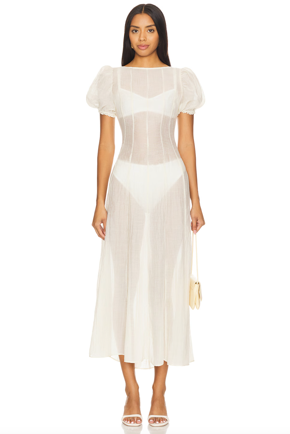 The Emory Dress embodies elegance with its soft chiffon fabric and romantic puff sleeves finished with elastic cuffs for a flattering fit. Its sheer, unlined design subtly reveals undergarments (not included), adding an ethereal touch to your look. A discreet back zip ensures a seamless silhouette, while gentle hand washing preserves its delicate texture. Perfect for making a stylish, modern statement with effortless grace.