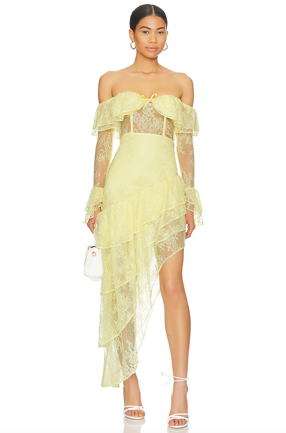 The Maddalena Gown by Majorelle combines timeless elegance with modern edge. This stunning piece features an off-shoulder silhouette with a structured boned bodice that flatters your figure, while delicate lace and playful ruffle details create movement and dimension. The asymmetric hem adds an unexpected twist that sets this gown apart, and the discreet back zipper ensures a seamless, polished look. Perfect for making an unforgettable entrance at any special occasion.