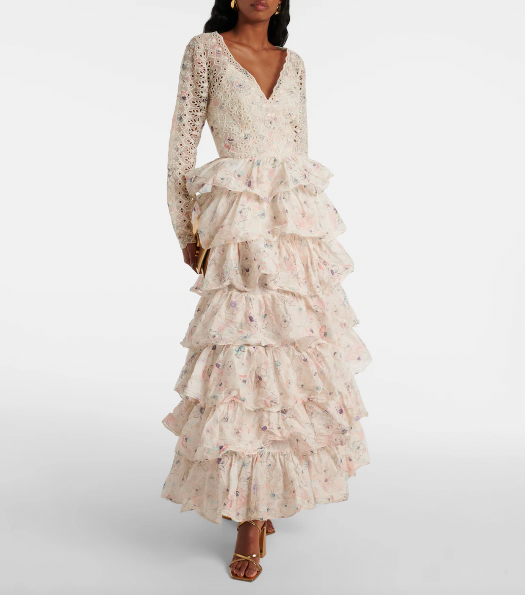Elevate your elegance with the Halliday ruffled tiered cotton gown by Zimmermann. Crafted from delicate broderie anglaise cotton, its flowing layered skirt moves gracefully with every step. The all-over floral print and charming ruffled details highlight your femininity, while the fitted waist and V-neck sculpt a flattering silhouette. Designed with long sleeves and a discreet rear zipper, this ankle-length gown ensures both comfort and sophistication. 