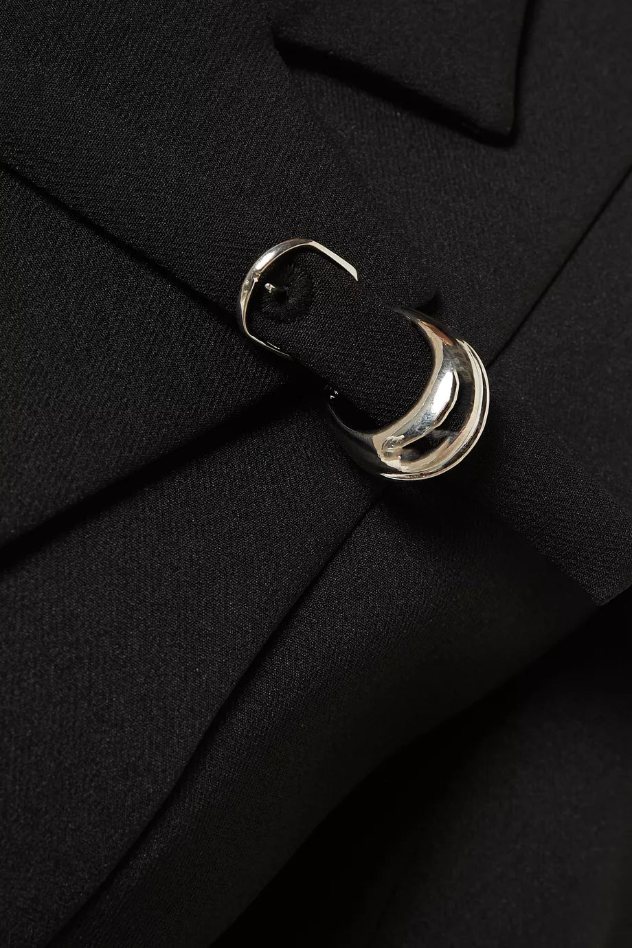 The Talgo Bar Suit Blazer Coat by Chats by C.Dam is your essential layering piece for effortless style. This tailored twill-suiting blazer features a sophisticated notched lapel, streamlined front closure, and distinctive buckled strap detail that elevates any outfit. Perfect for transitional weather, pair it with pumps for polished workdays or heeled boots as seasons change. 