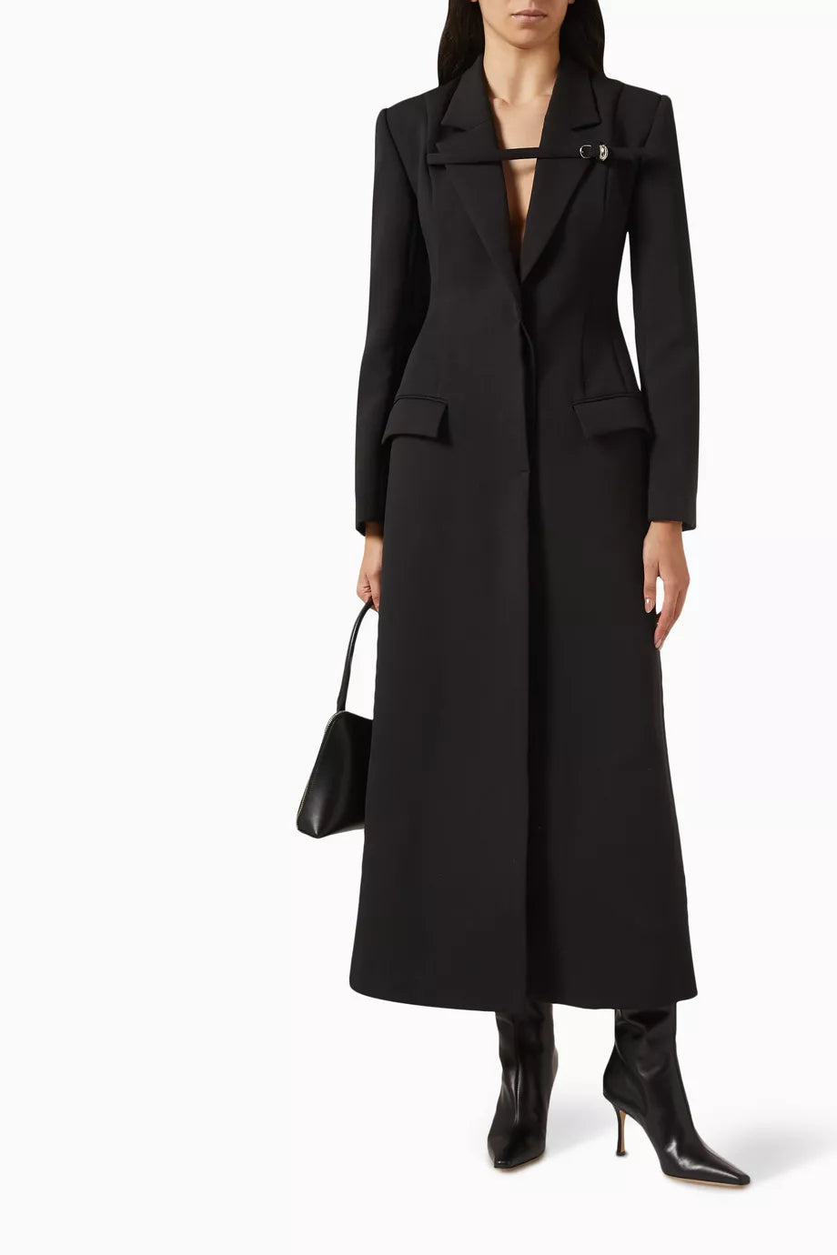 The Talgo Bar Suit Blazer Coat by Chats by C.Dam is your essential layering piece for effortless style. This tailored twill-suiting blazer features a sophisticated notched lapel, streamlined front closure, and distinctive buckled strap detail that elevates any outfit. Perfect for transitional weather, pair it with pumps for polished workdays or heeled boots as seasons change. 