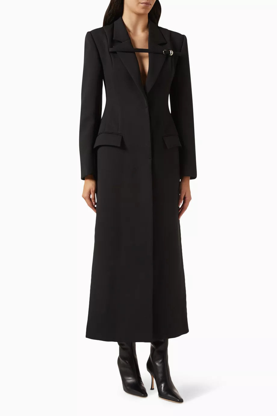 The Talgo Bar Suit Blazer Coat by Chats by C.Dam is your essential layering piece for effortless style. This tailored twill-suiting blazer features a sophisticated notched lapel, streamlined front closure, and distinctive buckled strap detail that elevates any outfit. Perfect for transitional weather, pair it with pumps for polished workdays or heeled boots as seasons change. 