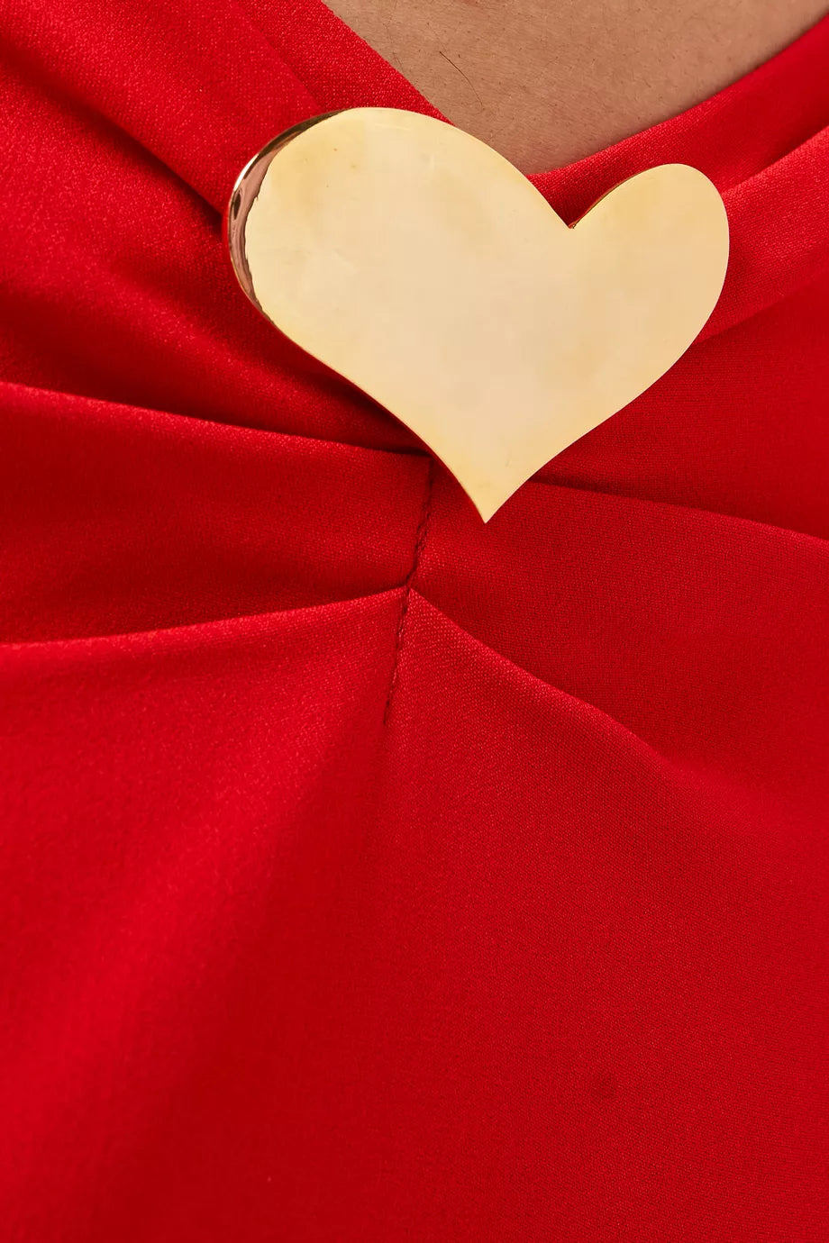 The Lovers Heart Jewel Cut-out Dress from Rowen Rose’s Love At First Sight Collection combines elegance and allure with a soft viscose blend fabric that moves gracefully. Featuring seductive front cutouts highlighted by signature gold-tone heart embellishments and a secure back zip closure, this maxi dress makes a stunning statement for any occasion. Embrace a look that effortlessly captivates and turns heads wherever you go.