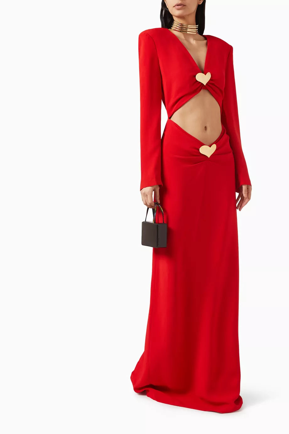 The Lovers Heart Jewel Cut-out Dress from Rowen Rose’s Love At First Sight Collection combines elegance and allure with a soft viscose blend fabric that moves gracefully. Featuring seductive front cutouts highlighted by signature gold-tone heart embellishments and a secure back zip closure, this maxi dress makes a stunning statement for any occasion. Embrace a look that effortlessly captivates and turns heads wherever you go.