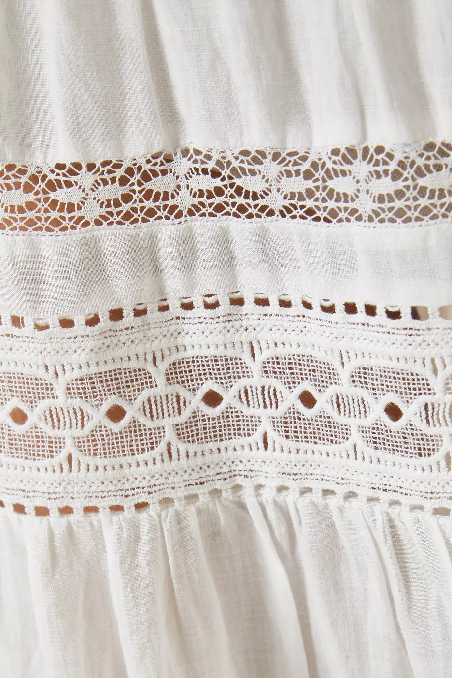 Get ready to turn heads at your next beach getaway with DÔEN's Santina Lace-trim Midi Dress! Made from lightweight ramie, this dress offers a relaxed fit and stunning semi-sheer silhouette that's perfect for catching the breeze. Plus, with snap button fastenings, you can show off as much (or as little) of your bikini as you'd like.