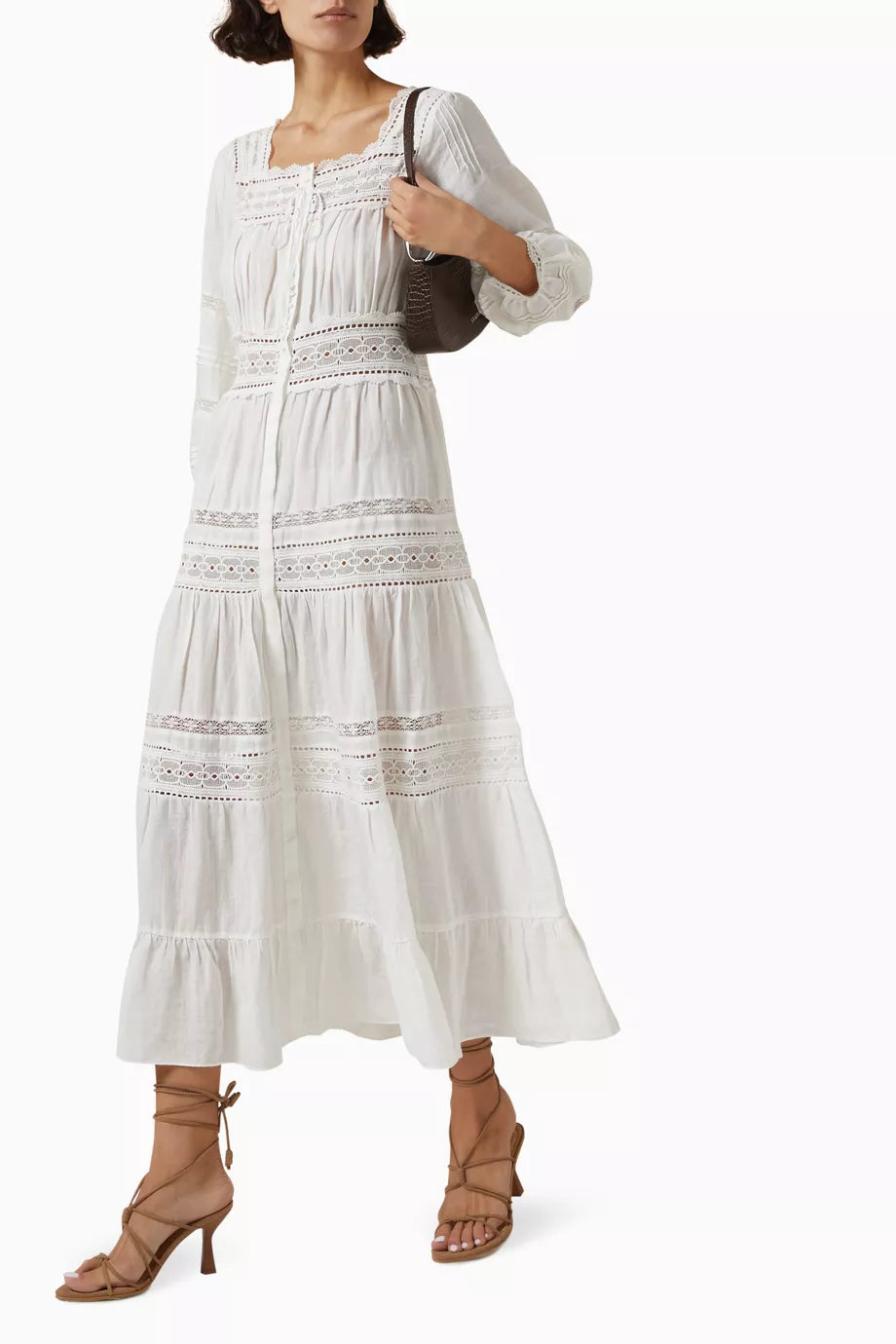 Get ready to turn heads at your next beach getaway with DÔEN's Santina Lace-trim Midi Dress! Made from lightweight ramie, this dress offers a relaxed fit and stunning semi-sheer silhouette that's perfect for catching the breeze. Plus, with snap button fastenings, you can show off as much (or as little) of your bikini as you'd like.