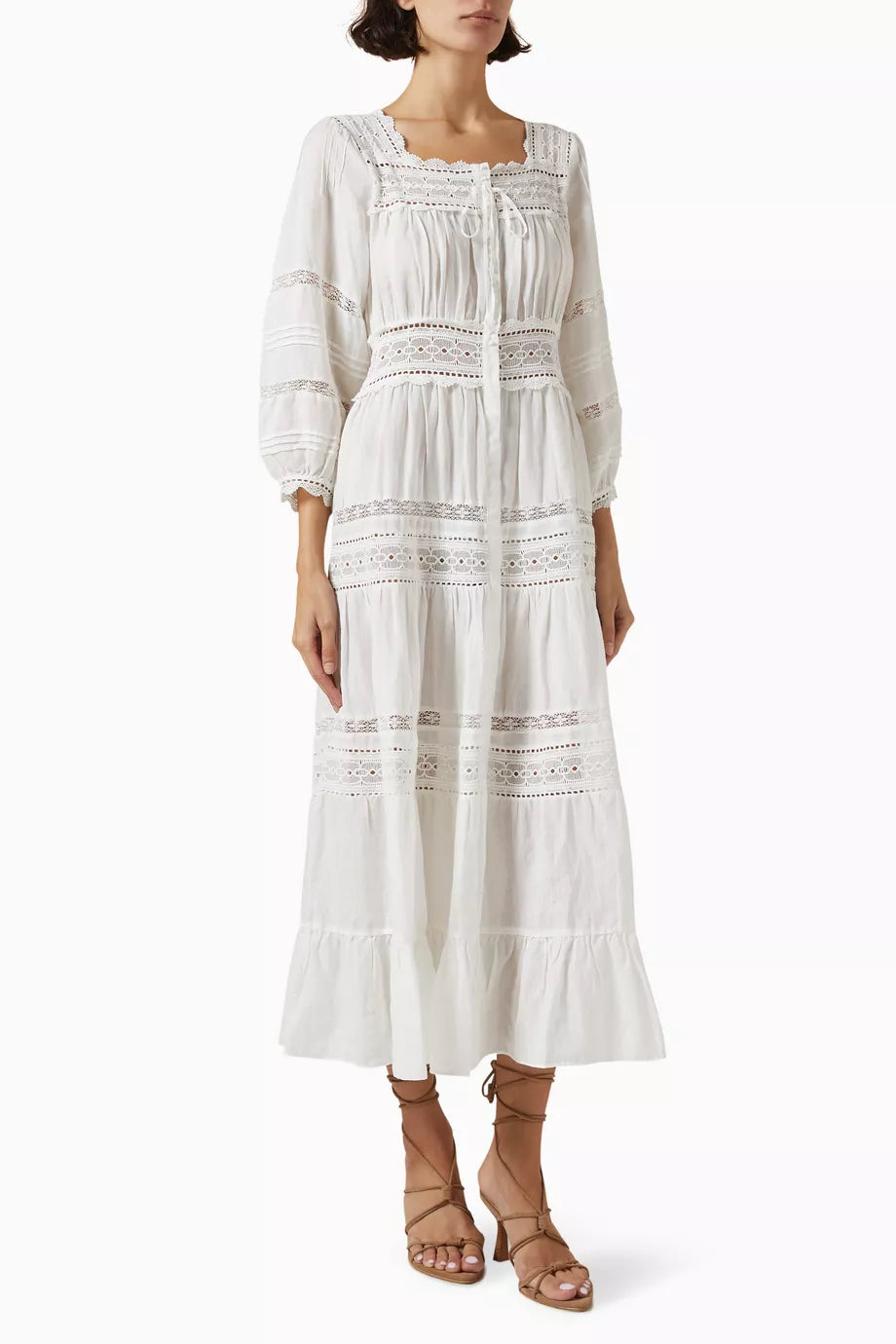 Get ready to turn heads at your next beach getaway with DÔEN's Santina Lace-trim Midi Dress! Made from lightweight ramie, this dress offers a relaxed fit and stunning semi-sheer silhouette that's perfect for catching the breeze. Plus, with snap button fastenings, you can show off as much (or as little) of your bikini as you'd like.