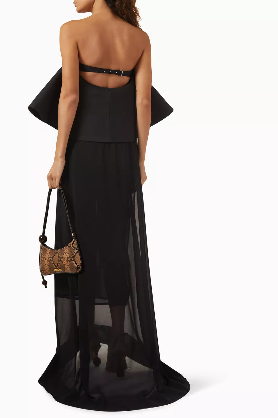 Elevate your style with the La Robe Vela Maxi Dress by Jacquemus, perfect for weddings and elegant soirées. Its silk-wool bustier with built-in boning shapes and supports for a flawless silhouette, while the semi-sheer chiffon skirt flows beautifully, creating an effortless sense of grace with every step. Make a memorable entrance with this striking, sophisticated dress designed to captivate.