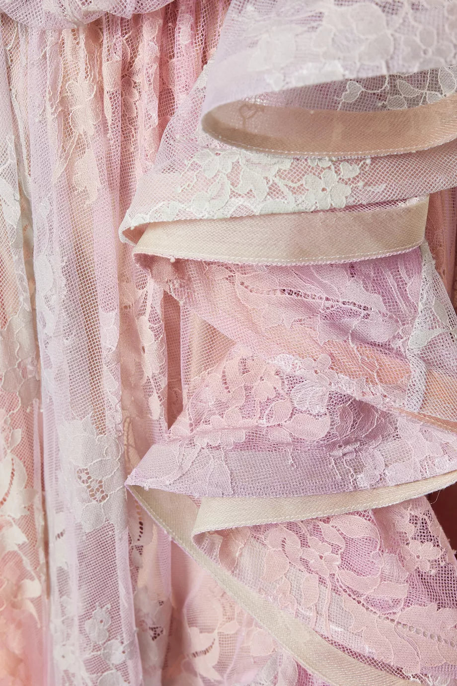 Step into the spotlight with the Dawning Ruffled Midi Dress in Lace from Zimmermann’s Spring 2025 Illumination Collection. This playful piece dazzles with asymmetric ruffles, a cape-style back, and a captivating side split flaunting a bold print. Perfect for turning heads at evening events, it pairs effortlessly with sleek heels and a chic clutch for a look that’s both dramatic and delightfully fun.