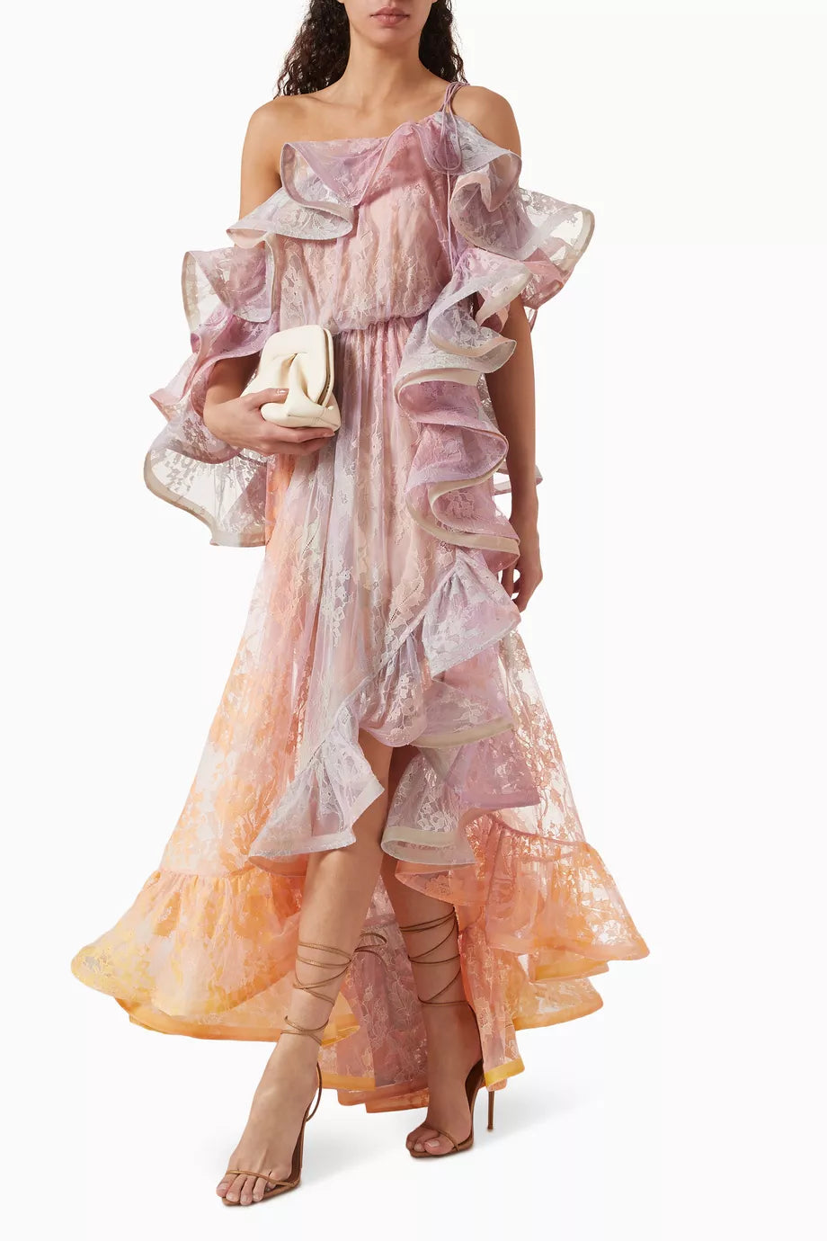 Step into the spotlight with the Dawning Ruffled Midi Dress in Lace from Zimmermann’s Spring 2025 Illumination Collection. This playful piece dazzles with asymmetric ruffles, a cape-style back, and a captivating side split flaunting a bold print. Perfect for turning heads at evening events, it pairs effortlessly with sleek heels and a chic clutch for a look that’s both dramatic and delightfully fun.