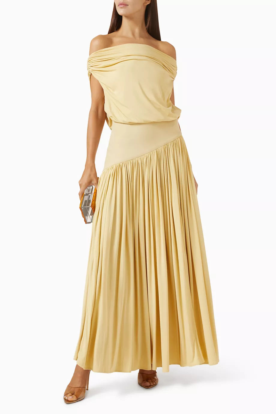 Discover effortless elegance with the Gwen Off-shoulder Dress by Abadia, crafted from luxuriously soft bamboo jersey that breathes with you throughout the day. The fabric's natural stretch ensures a flattering fit that moves with your body, while the graceful pleated skirt creates beautiful movement with every step. Style it your way—wear the neckline off-the-shoulder for a bold statement or draped to one side for understated sophistication. 