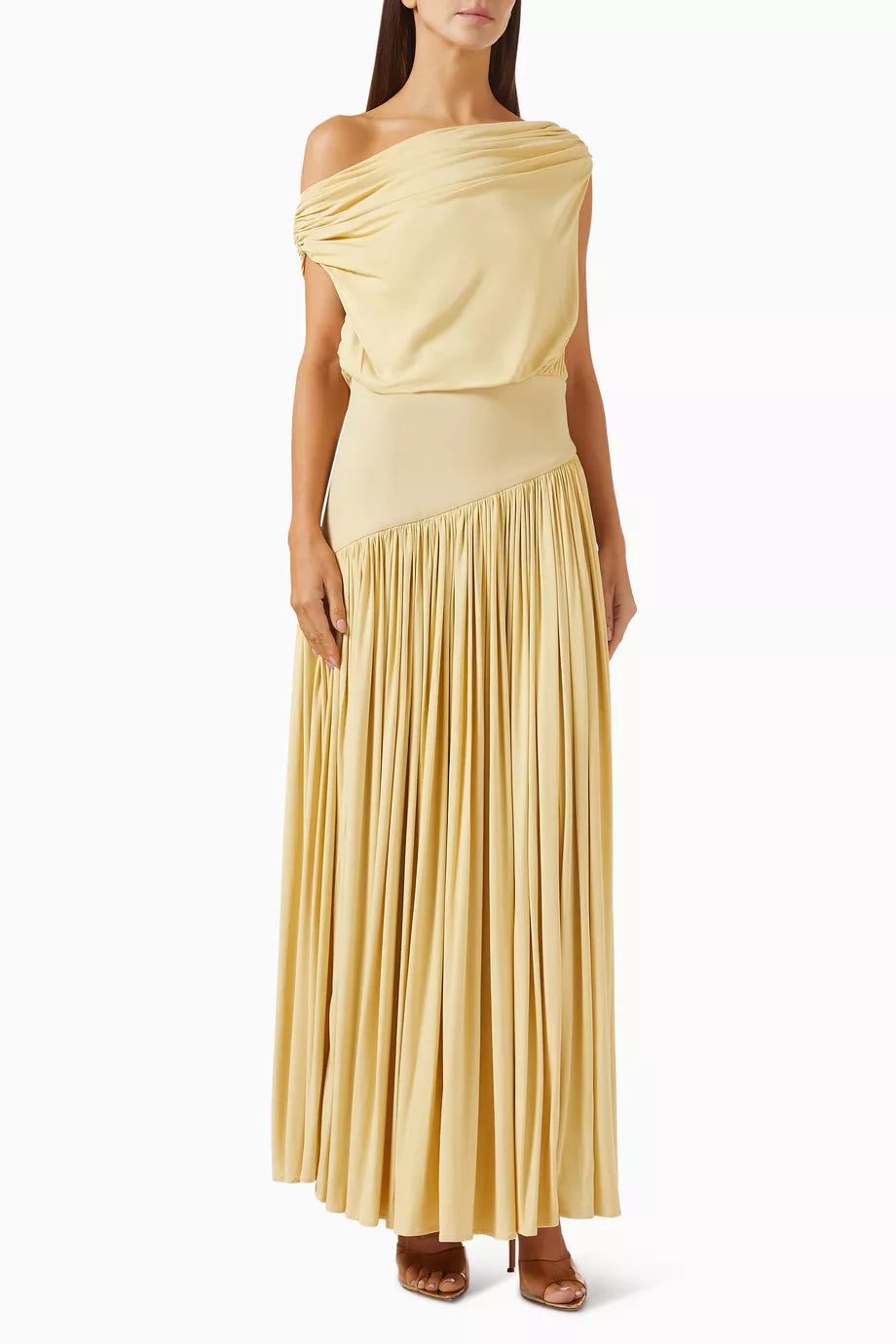 Discover effortless elegance with the Gwen Off-shoulder Dress by Abadia, crafted from luxuriously soft bamboo jersey that breathes with you throughout the day. The fabric's natural stretch ensures a flattering fit that moves with your body, while the graceful pleated skirt creates beautiful movement with every step. Style it your way—wear the neckline off-the-shoulder for a bold statement or draped to one side for understated sophistication. 