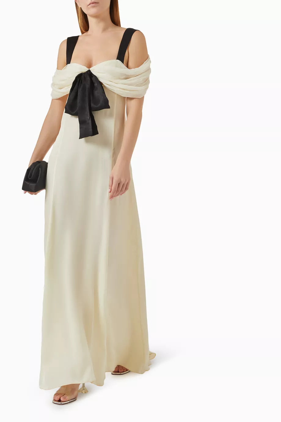 Elevate your evening elegance with the Elodie Off-shoulder Maxi Dress by Siedres, where timeless sophistication meets modern allure. Crafted from luxuriously flowing chiffon, this maxi dress drapes beautifully to create a graceful, elongated silhouette that flatters every frame. The striking off-shoulder neckline exudes romance and femininity, while the exquisite bow detail at the bodice serves as a stunning focal point that captures attention. 