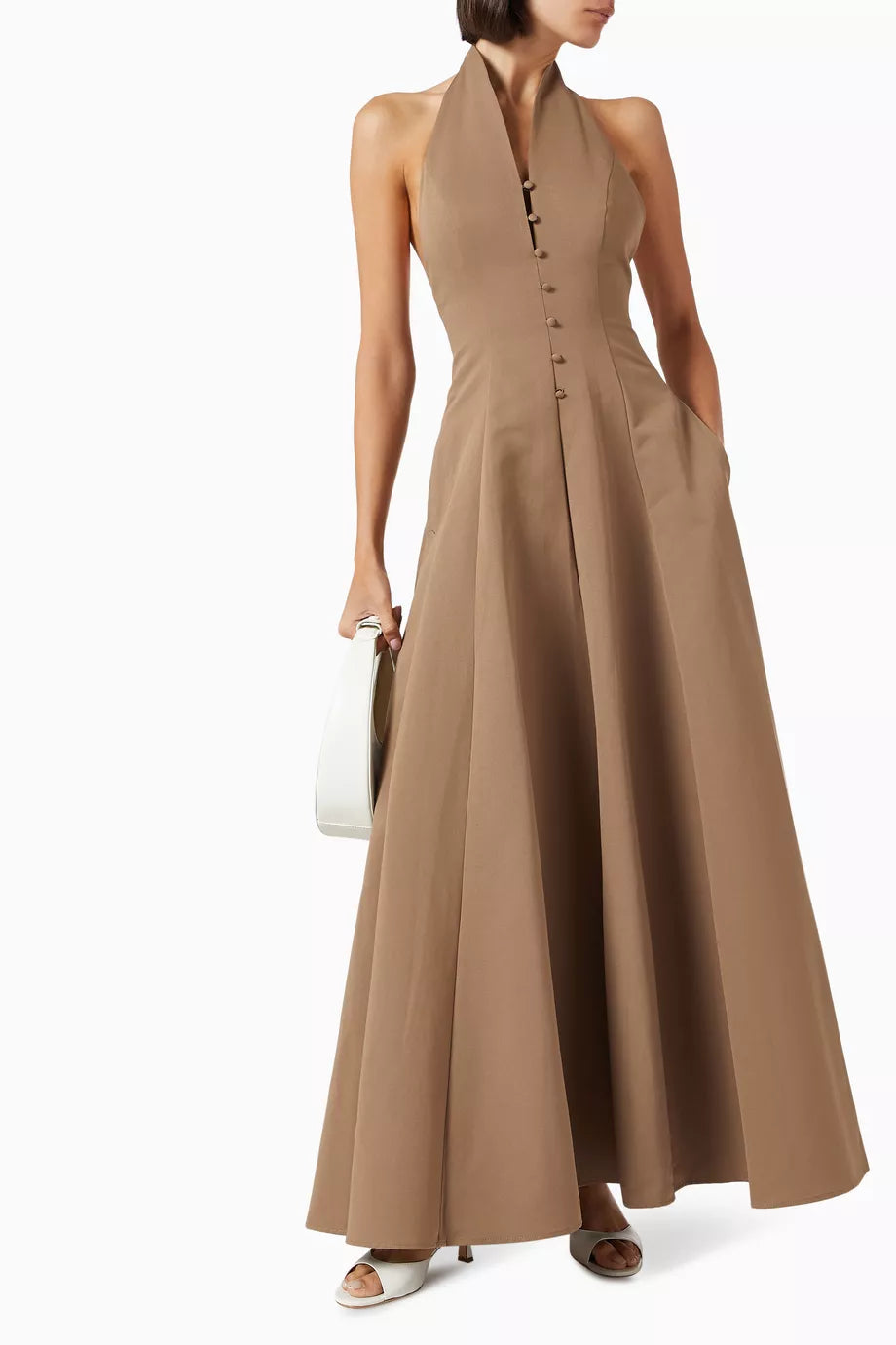 Effortlessly elegant, the Stella Maxi Dress from Staud is a must-have for your wardrobe. Made of a soft cotton blend, it features a fitted bodice and structured waistline, creating a stunning silhouette. Perfect for any occasion, this dress will make you feel confident and stylish.